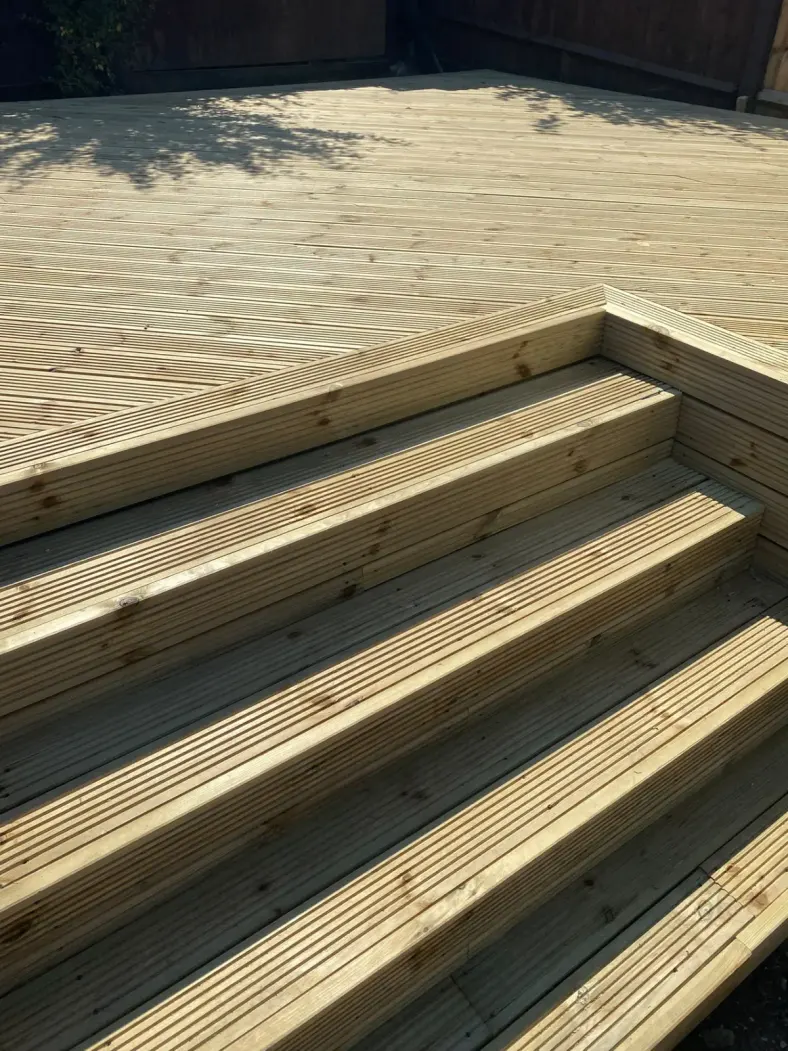 Close-up of new grooved timber decking with wide steps